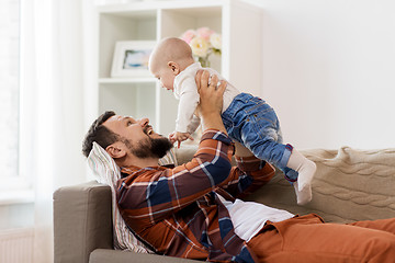 Image showing happy father with little baby boy at home