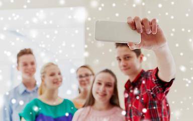 Image showing group of students taking selfie with smartphone
