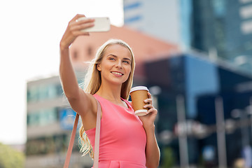 Image showing woman with coffee taking selfie by smartphone