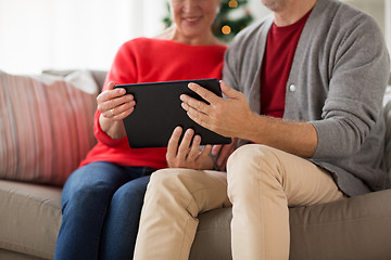 Image showing senior couple with tablet pc at christmas