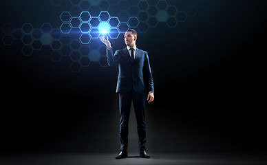Image showing businessman working with virtual network hologram