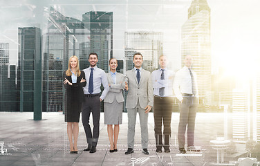 Image showing group of smiling businessmen making handshake