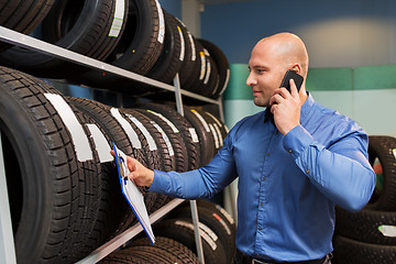 Image showing auto business owner ordering tires at car service