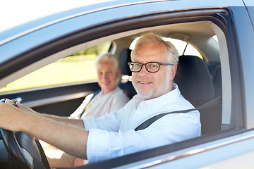 Image showing happy senior couple driving in car