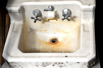 Image showing Old rusty wash basin.