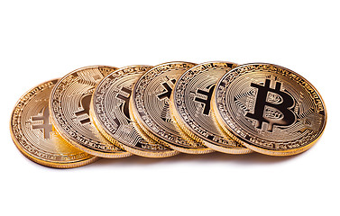 Image showing Shiny Bitcoin souvenire coins row isolated