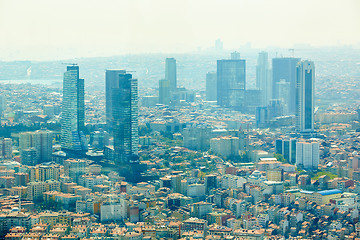 Image showing Istanbul, Turkey - 1 April, 2017: Urban landscape of European side of Istanbul and Bosphorus Strait on a horizon. Modern part of city with business towers of international corporations, skyscrapers an