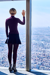 Image showing Young woman in the window