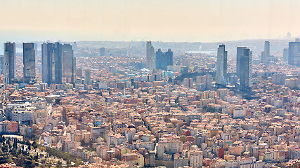 Image showing Istanbul, Turkey - 1 April, 2017: Urban landscape of European side of Istanbul and Bosphorus Strait on a horizon. Modern part of city with business towers of international corporations, skyscrapers an