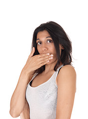 Image showing Woman holding hand over mouth looking surprised. 