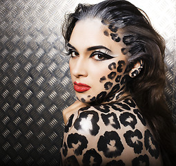 Image showing young sexy woman with leopard make up all over body, cat bodyart