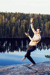 Image showing middle age man doing sport yoga on the top of the mountain, lifestyle people outdoor, summer wild nature for training