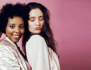 Image showing different nation girls with diversuty in skin, hair. scandinavian, african american cheerful emotional posing on pink background, woman day celebration, lifestyle people concept