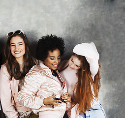 Image showing Lifestyle and people concept: young pretty diversity nations woman  together happy smiling, making selfie. African-american and caucasian