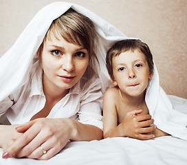 Image showing young blond woman with little boy in bed, mother and son, happy familyyoung blond woman with little boy in bed, mother and son, happy family 