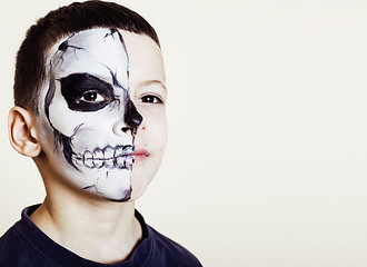 Image showing little cute boy with facepaint like skeleton to celebrate hallow