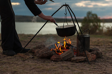 Image showing Preparing food on campfire