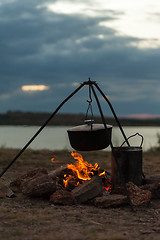 Image showing Preparing food on campfire