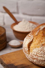 Image showing Homemade bread on old cutting board