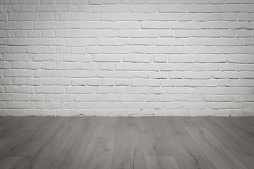 Image showing Old white brick wall and wood floor background