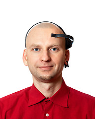 Image showing Portrait of young man with electroencephalography (EEG) headset 