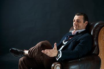 Image showing Businessman sitting on an armchair