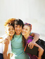 Image showing cute group of teenages at the building of university with books huggings, back to school