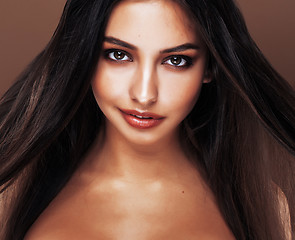 Image showing cute happy young indian woman in studio close up smiling, fashion mulatto