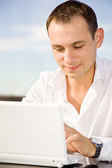 Image showing businessman on leisure with laptop