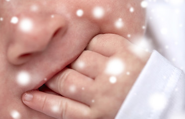 Image showing close up of baby sucking his fingers