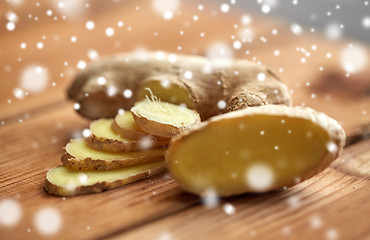 Image showing close up of ginger root on wooden table