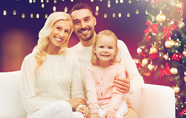 Image showing happy family over christmas tree