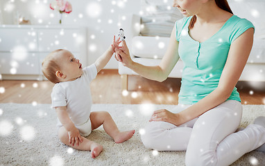 Image showing happy mother and baby playing at home