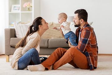 Image showing happy family with baby having fun at home