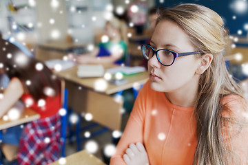 Image showing student girl in eyeglasses at school lesson