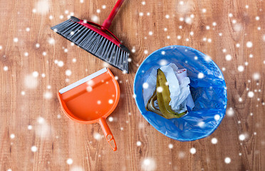 Image showing rubbish bin with trash, swab and dustpan on floor