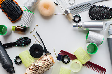 Image showing hair brushes, styling sprays, curlers and pins