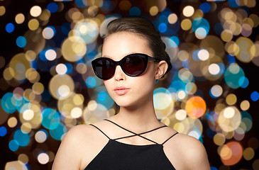 Image showing beautiful young woman in elegant black sunglasses