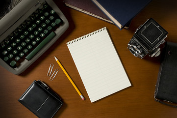 Image showing Blank steno notepad on a desk among vintage journalism props