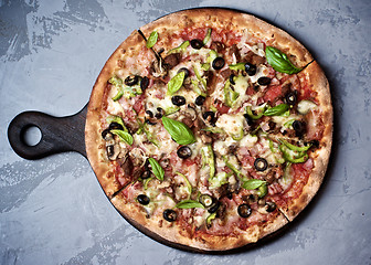 Image showing Delicious Pizza with Ham, Olives and Jalapenos