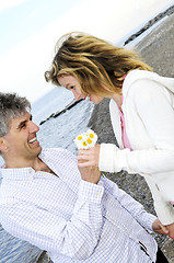 Image showing Mature romantic couple with flowers