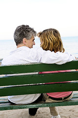 Image showing Mature romantic couple on a bench