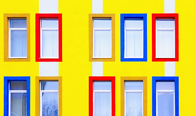 Image showing Yellow Wall With Colorful Windows