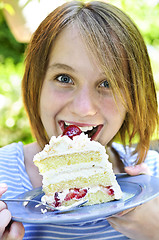 Image showing Girl eating a cake