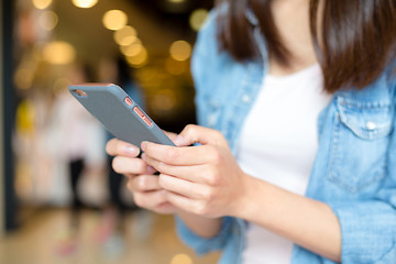 Image showing Woman hand using cell phone