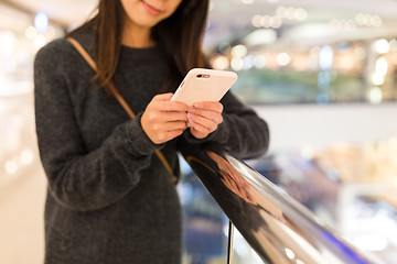 Image showing Woman working on cellphone