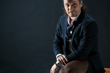 Image showing Businessman sitting on an armchair