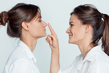 Image showing Studio portrait of female twins