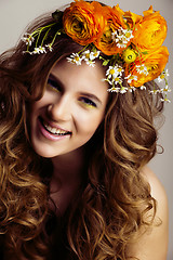 Image showing Beauty young woman with flowers and make up close up, real sprin