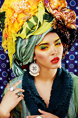 Image showing beauty bright woman with creative make up, many shawls on head l